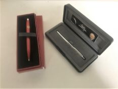 A boxed Fisher Space Pen and a boxed Ferrari ball-point pen (2)