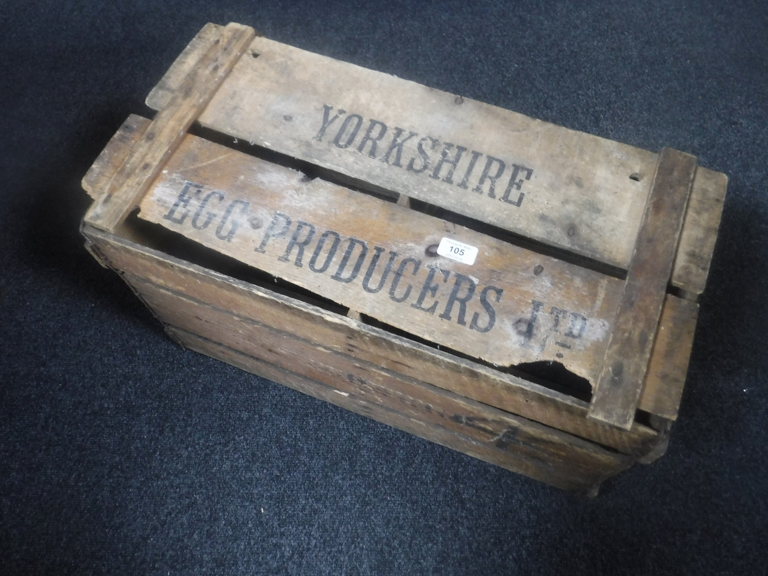 A wooden crate bearing Yorkshire Hen Producers Ltd writing