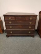 A George III mahogany chest of six drawers on bracket feet,