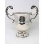 An Edwardian silver twin-handled trophy cup, Walker & Hall, Sheffield 1907, engraved 'Challenge Cup,