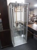 A contemporary glass door display cabinet