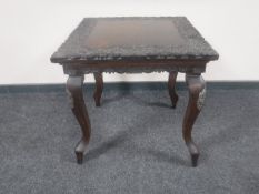 An early 20th century carved Eastern occasional table