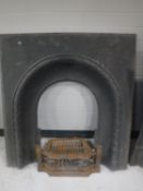 A cast iron fire surround with fire grate
