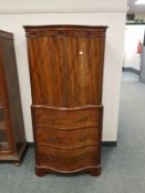 A mahogany serpentine front drinks cabinet,