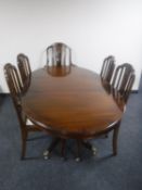 A Regency style inlaid mahogany dining table with leaf and five good quality dining chairs