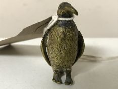 A miniature bronze penguin,