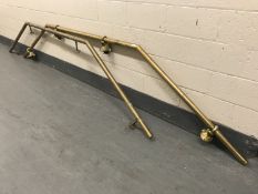 A brass bar hand rail and foot rail