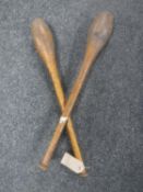 A pair of vintage wooden throwing/juggling clubs