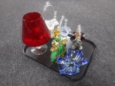 A tray containing three Murano glass baskets together with a Venetian figure of a lady and two