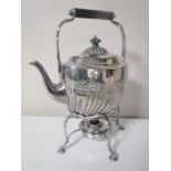 A silver plated spirit kettle on stand with burner