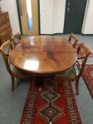 A reproduction mahogany extending dining table with leaf, length 155cm,