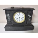 A Victorian slate and marble mantel clock with enamel dial,