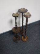 Three oak smoker's stands with brass ash trays