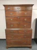 A George III oak chest on chest fitted ten drawers,