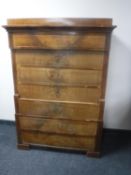A late 19th century continental mahogany seven drawer chest