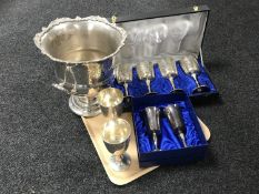 A tray of plated ice buckets and eight goblets