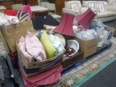 Two pallets containing soft furnishings, table lamps, dinner ware,