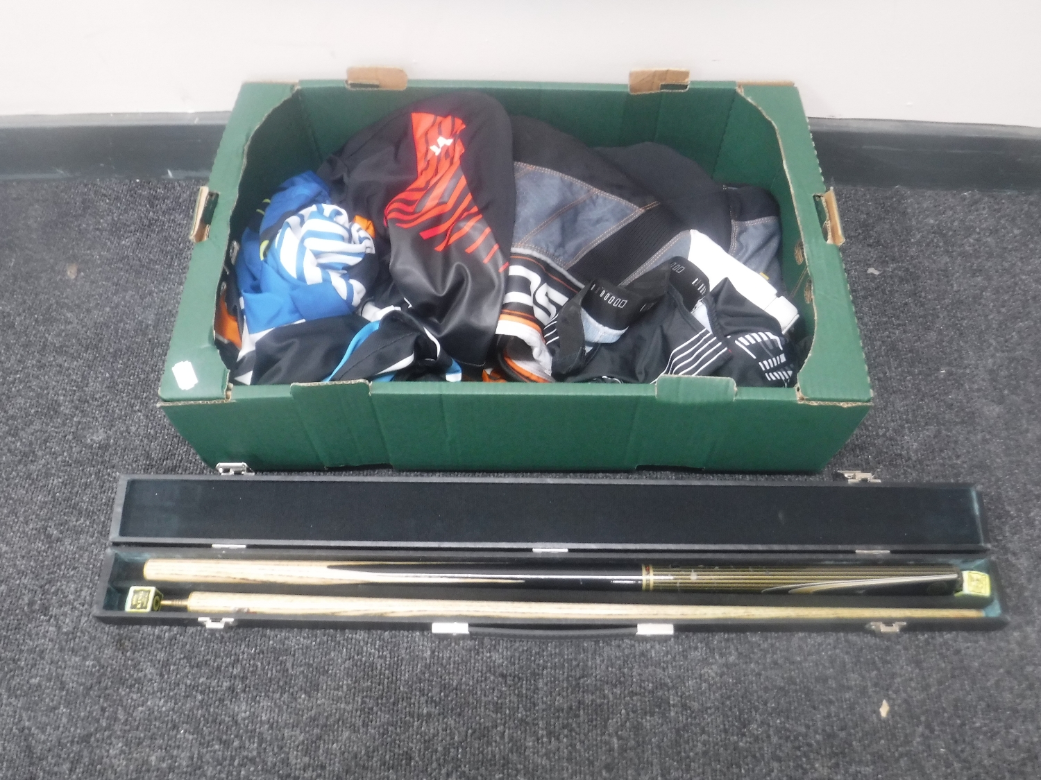 A box of motorcycle clothing,