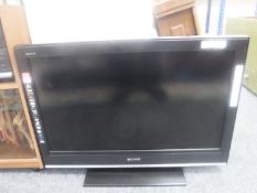 A Sony Bravia 32 inch LCD TV with remote