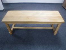 A continental blond oak refectory coffee table