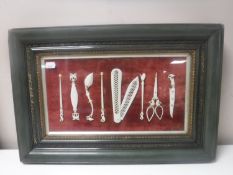 A framed eight piece set of carved bone Turkish barber's tools