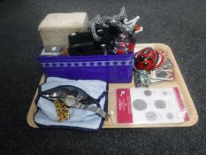 A tray of assorted wristwatches, NASA sew on patches, replica coins, toys,