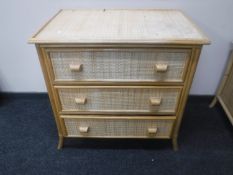 A bamboo and wicker three drawer chest together with matching blanket box