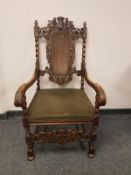 A continental heavily carved beech armchair,