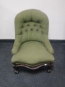 A Victorian lady's chair upholstered a green buttoned fabric