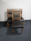 A pair of early 20th century oak dining chairs together with one other similar