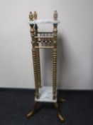 A gilt wood and marble two tier plant stand