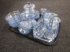 A tray of Art Deco blue glass trinket set, glass dressing table jars,
