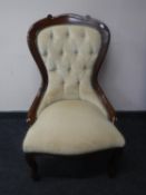 A lady's chairs upholstered in a buttoned fabric
