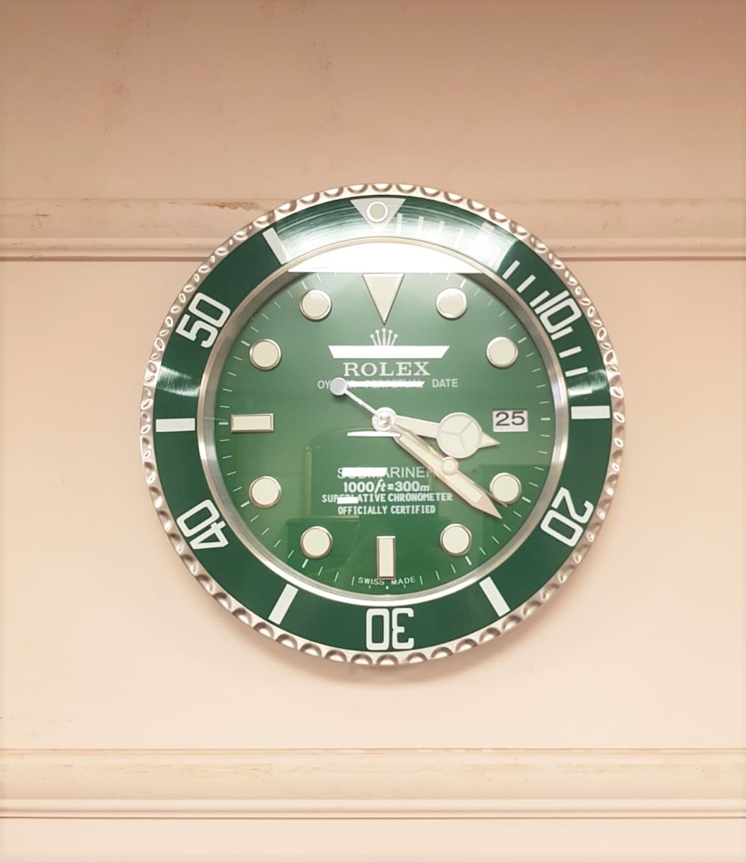 A contemporary 'Rolex' wall clock