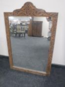 A carved frame mirror