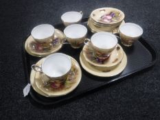 A tray of Aynsley Orchard Gold fruit patterned trios