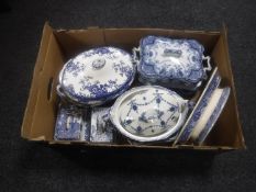 A box of antique blue and white tureens, two lidded butter dishes,