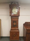 A 19th century inlaid mahogany longcase clock with painted dial,