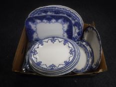 A box of antique blue and white meat plates and ashettes