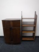 A 1930's walnut stereo cabinet together with a set of open bookshelves