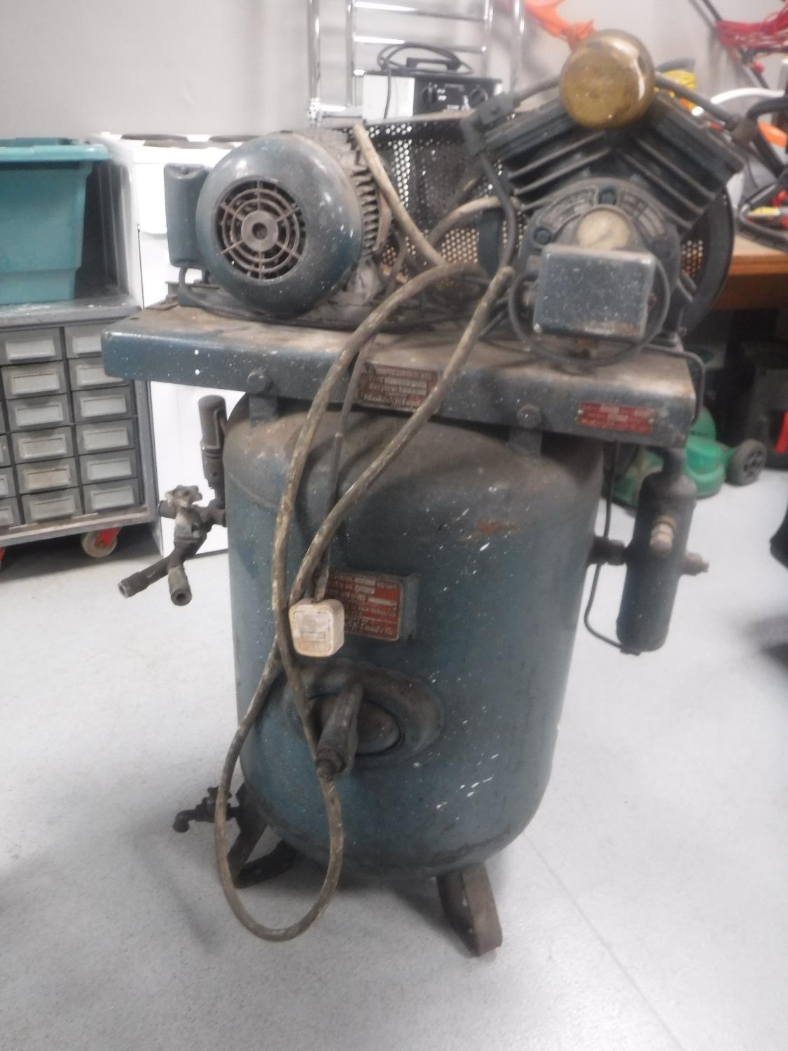 A vintage industrial air compressor