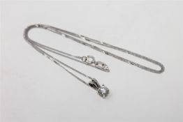 An 18ct white gold diamond set pendant on chain, the brilliant-cut stone weighing approximately 0.