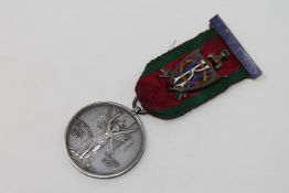 A scarce Masonic silver medal awarded for service in the First World War, presented to Kt. R.