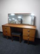 A 1970's Symbol Furniture teak dressing table with stool