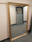 A gilt framed overmantel mirror,