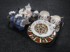 A tray of three piece antique pottery tea service, miniature Imari loving cup,