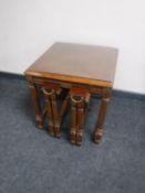 A nest of three colonial style tables