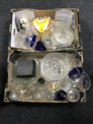 Two boxes of assorted glass ware and a small brass framed mirror
