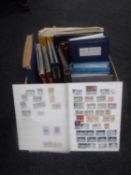 A box of 20th century stamp albums containing stamps of the world