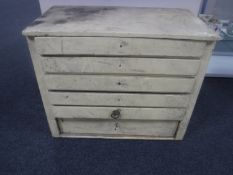 An antique painted pine six drawer chest